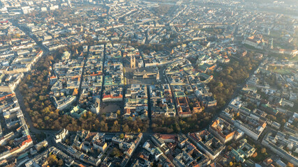 Obraz premium Wide Aerial Panorama of Krakow City Center in Autumn With Historic Districts Parks and Dense Urban Architecture