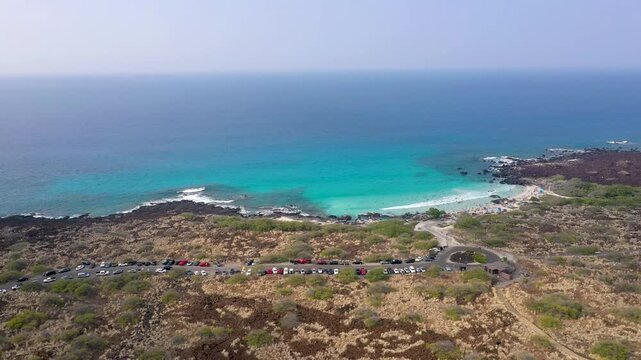 Aerial Lateral Tracking Shot of Turquoise Lagoon and Lava Rock Coastline, Big Island Hawaii