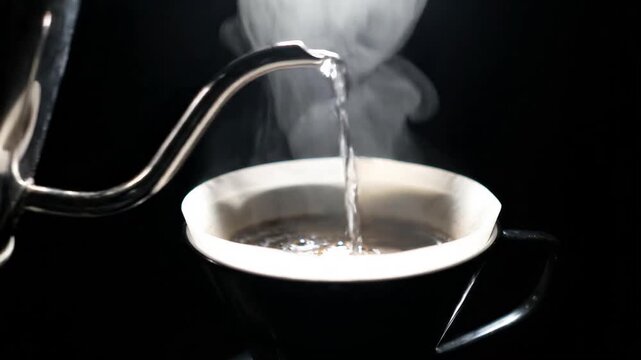 Making fresh v60 pour over coffee. Pouring Hot water from gooseneck kettle to v60 dripper