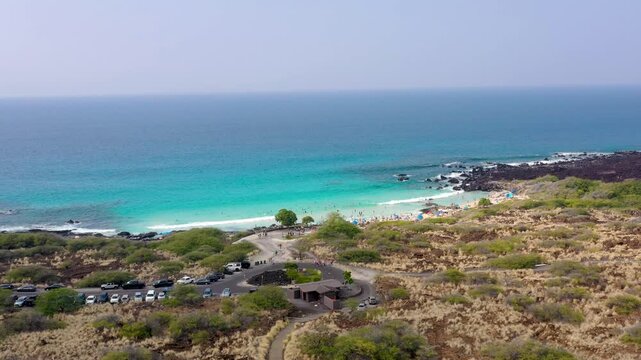 Low Altitude Aerial Approach to Tropical Beach with People Swimming and Tanning, Big Island Hawaii