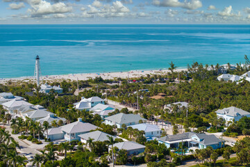 Obraz premium Rich neighborhood with expensive vacation homes in Boca Grande, small town on Gasparilla Island in southwest Florida. Wealthy waterfront residential area