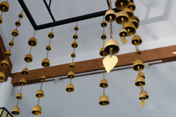 Brass wind chimes in the gold-colored metal