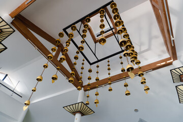 Brass wind chimes in the gold-colored metal