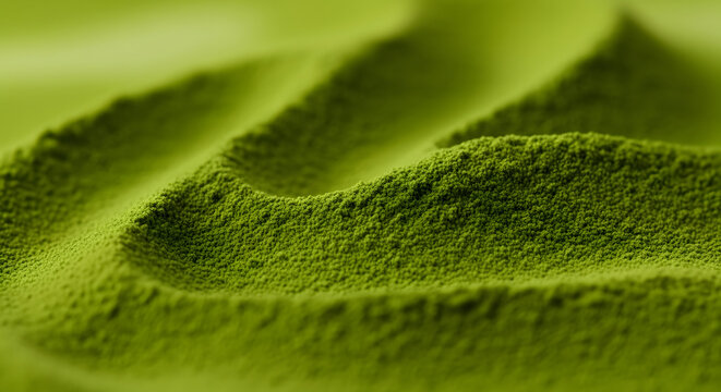 Flowing textured surface of green matcha powder creates a dynamic, natural background perfect for health, food, or branding visuals.