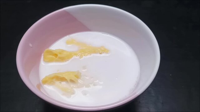 Footage of Sweet Fermented Cassava Dessert with Coconut Milk