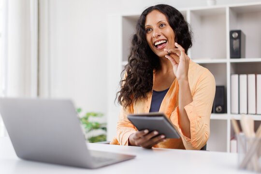 Finance, office worker sitting and taking notes on meeting topics at desk in office to present ideas on summarizing finance, accounting, marketing content in meeting.
