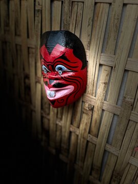 Mask of venice, Javanese folk art mask featuring red face and fangs