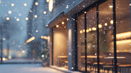 Cozy winter caf&eacute; exterior with snow gently falling and warm lights glowing through the windows. Peaceful and calm atmosphere on a cold winter evening, creating a welcoming and relaxing urban scene.