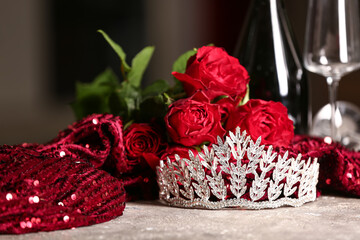 Beautiful tiara with roses and prom dress on grunge table, closeup © Pixel-Shot