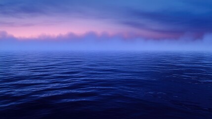 Obraz premium Serene Ocean Vista: Pink-Tinged Clouds Hover Above Deep Blue Waters at Twilight
