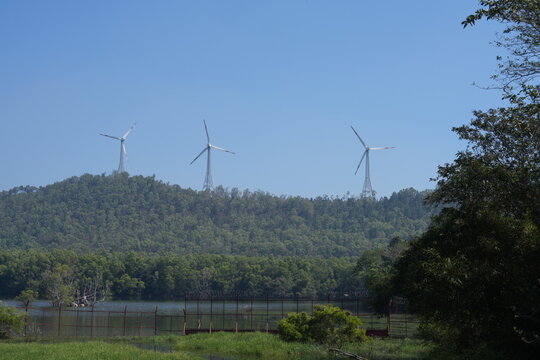 Wind turbines installed on lush green hills along the scenic route between Tirupati and Tirumala, Andhra Pradesh, India