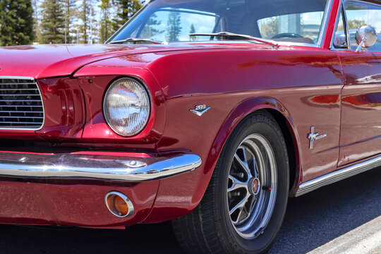 Perth, Western Australia, Australia - November 10 2024: Iconic classic red colored Ford Mustang, 1964 to 1966 model with 289 cubic inch (4.7 liter) V8 engine. American muscle cars. "Pony car". Vintage