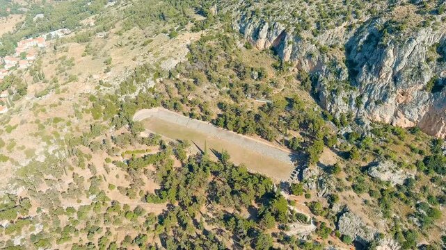 Delphi, Greece. Delphi Antique Stadium. Ruins of the ancient city of Delphi. Sunny weather in the morning, Summer. Drone footage