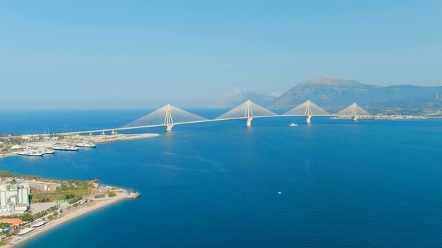 Patras, Greece. The Rio-Antirrio Bridge. Officially the Charilaos Trikoupis Bridge. Bridge over the Gulf of Corinth (Strait of Rion and Andirion). Drone footage, Departure of the camera, Departure of