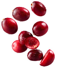 Obraz premium Close-up shot of fresh cranberries, some sliced, showcasing their vibrant red color