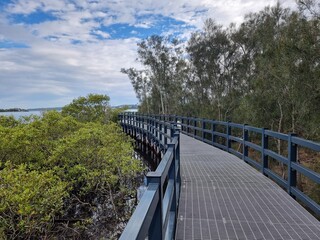 The Swansea Boardwalk on Lake Macquarie New South Wales. Surrounded by mangroves under a cloudy sky