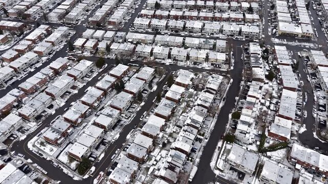 Aerial winter view of Montreal suburbs, snowy angrignon park and river near Lachine and Verdun under cloudy sky. g.