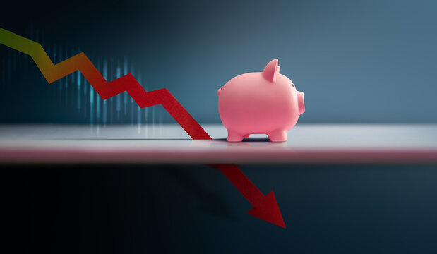 Piggy bank with downward market graph and arrow.economic crisis, financial downturn, market volatility