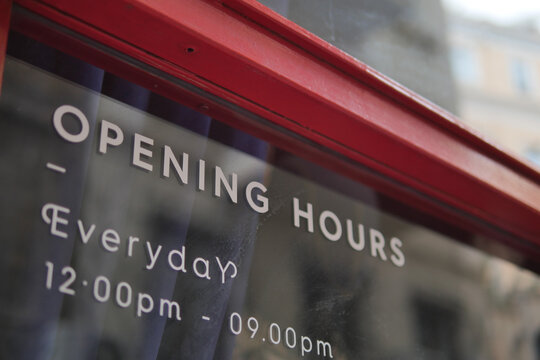 Hours for visitors displayed on the shop window