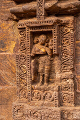 This erotic stone sculpture at the Konark Sun Temple depicts an intimate couple in close embrace, symbolizing fertility, human desire, and tantric philosophy in Odishan temple art.
