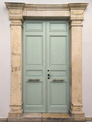 Fototapeta premium old wooden door in a stone wall