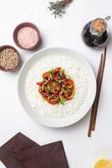 Rice with fried shrimp in teriyaki sauce. Seafood. Asian cuisine.