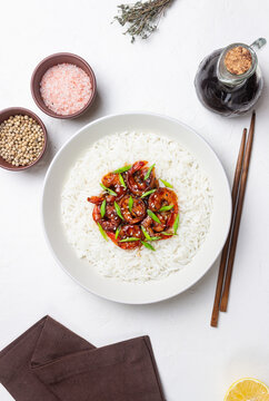 Rice with fried shrimp in teriyaki sauce. Seafood. Asian cuisine.