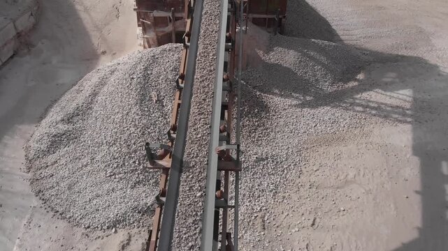 The conveyor moves the processed rock