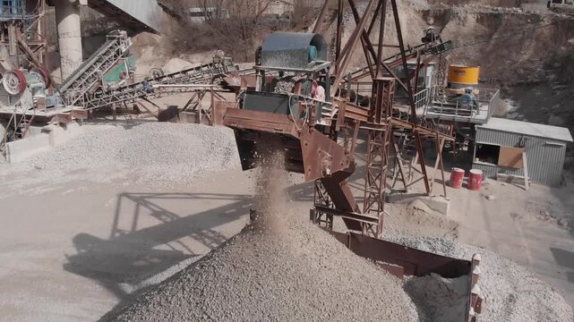 The conveyor moves the processed rock