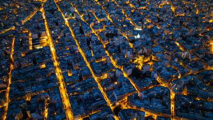 Aerial Cityscape at Dusk with Illuminated Grid Streets © gpahas