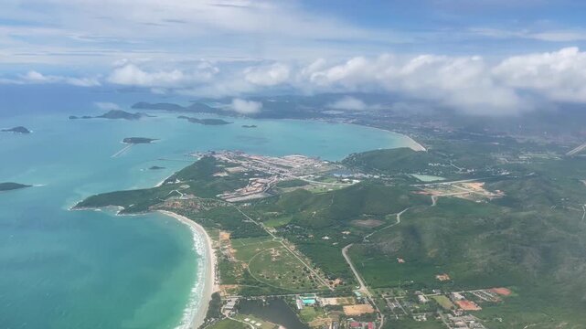 Aerial view of Phuket Island bays and coastline showing tropical beaches, turquoise sea, and curved shorelines. Scenic island landscape, travel, tourism, vacation, aerial nature footage concepts