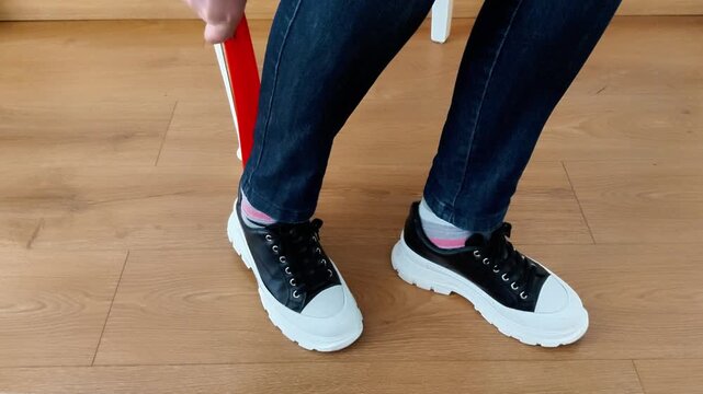 Slip on shoes effortlessly with this guide. Learn the proper way to use a shoe horn to save your heels, protect your footwear, and get out the door in seconds. Fast easy.