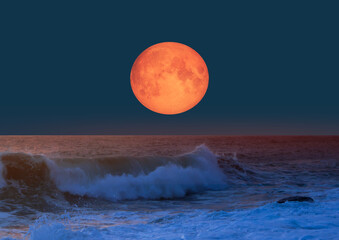 Full moon rising over the sea at sunset "Elements of this image furnished by NASA" © muratart