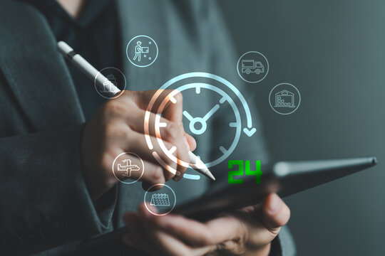 Business hand using digital tablet with glowing 24 hour delivery logistics. Concept of fast, real-time delivery, shipping, transportation, supply chain and warehouse automation management systems.