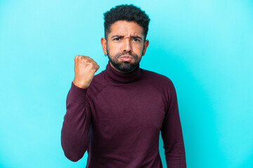 Fototapeta premium Young Brazilian man isolated on blue background with unhappy expression