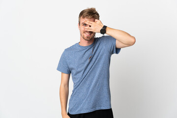 Fototapeta premium Young handsome man isolated on white background covering eyes by hands and smiling