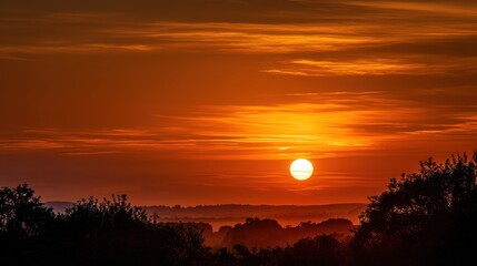 Golden Hour Panorama: A breathtaking view of the radiant sunset illuminating the horizon. The landscape silhouette, creating a dramatic, tranquil, and picturesque panorama.
