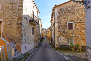 Fototapeta premium A street among the old houses of Pisterzo, a farming village in the Lazio region, Italy.
