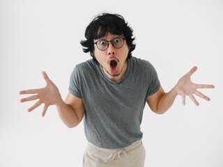 asian man startled man with glasses wide mouth, asian male displays shocked expression with open mouth, man from asia shows astonishment with mouth isolated on white background