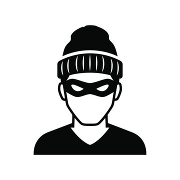 Black silhouette of a masked person wearing a beanie