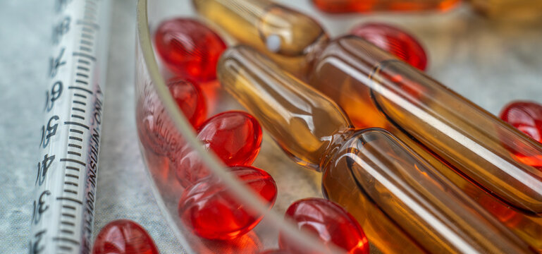 Orphan medicines.Medical background with medications.The insulin syringe is on the table.
