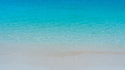 Obraz premium sand beach and sea wave top view background