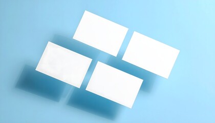 Four White Business Cards on Blue Background.