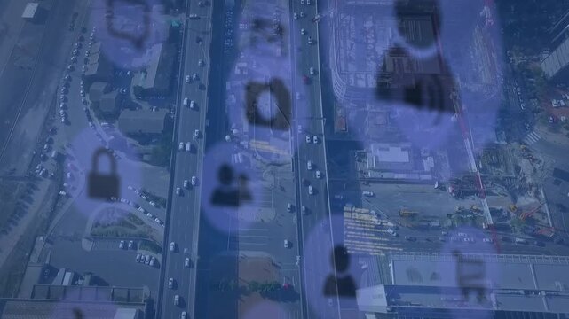 Multiple digital icons and data processing against aerial view of cityscape