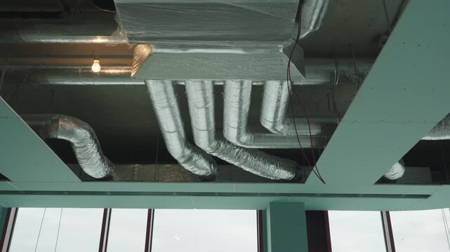 Installation of air ducts for the heating, ventilation, and air conditioning system in an office building	
