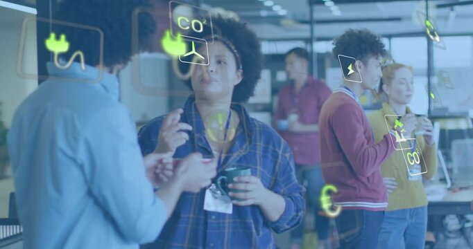 Coworkers tapping smartphone while discussing energy data as neon-yellow icons emerging around them