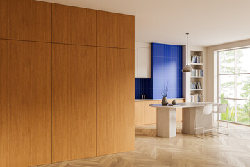 Modern kitchen interior with wood panel wall and blue tile background in bright open space with minimalist furniture and natural light setting. 3D Rendering