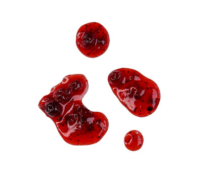 Drops and stains of liquid red berry jam or sauce isolated on transparent background, top view, PNG.
