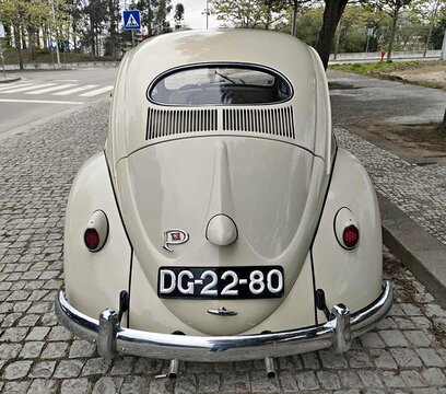 Volkswagen Beetle classic car parked on cobblestone street