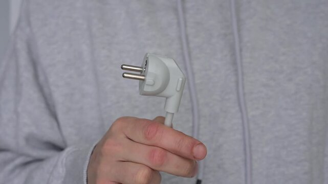 An electrical plug for connecting electrical appliances.
High-voltage plug.
Electrical connector.